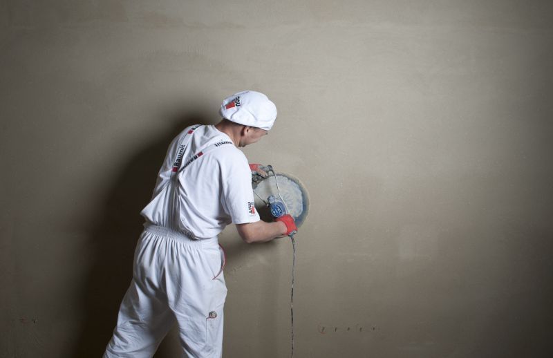 Zacieranie końcowe powierzchni tynku za pomocą zacieraczki mechanicznej